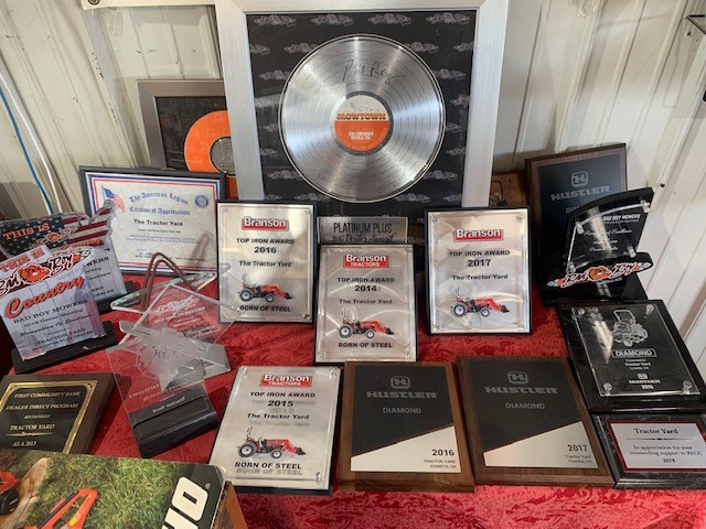 Awards from Bad boy Mowers, TYM Tractors, and Hustler Mowers